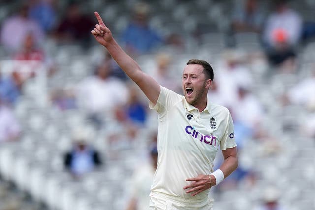 <p>Ollie Robinson celebrates a wicket</p>