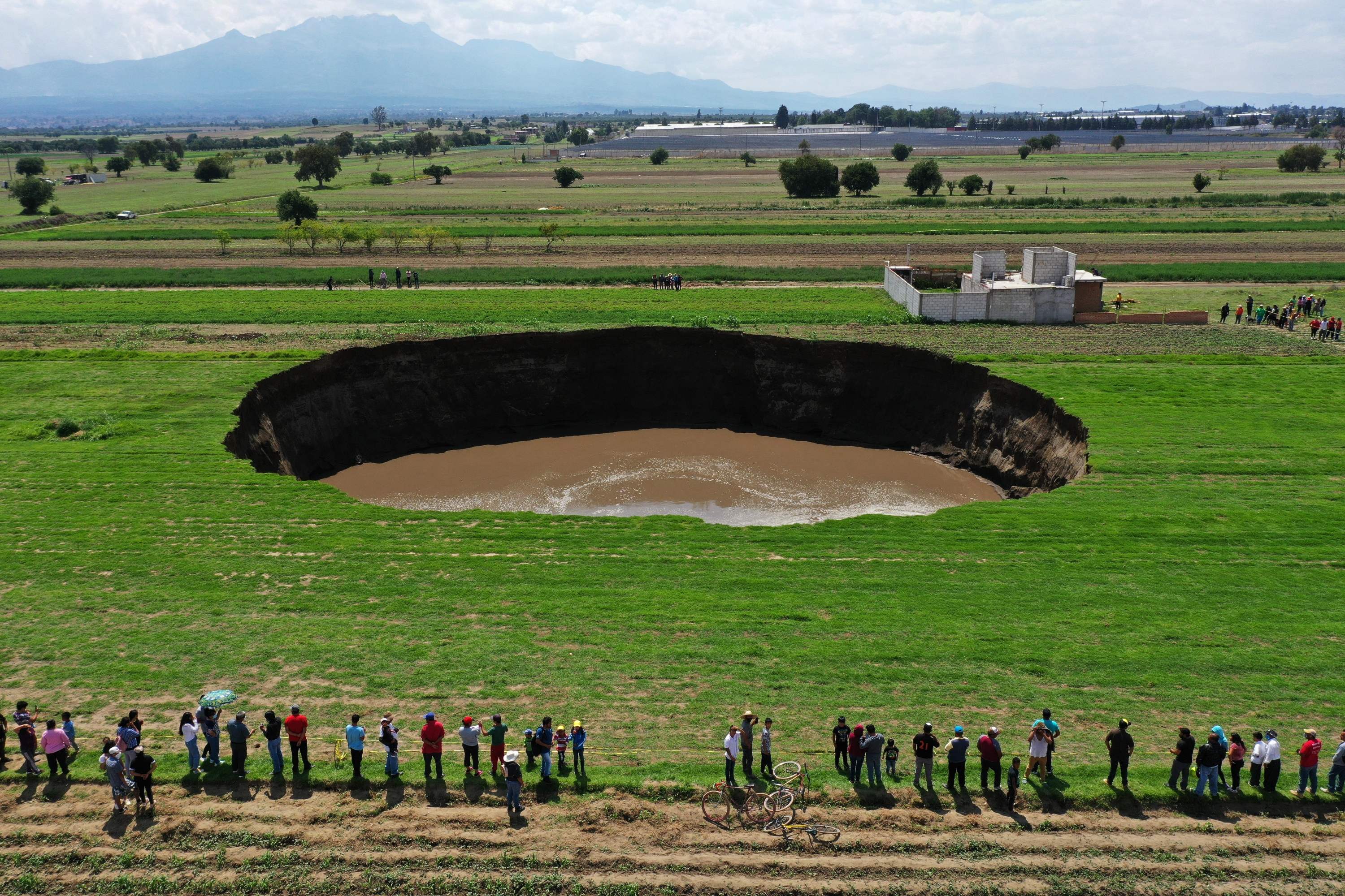 Locals have been coming to the site in large number to witness the expanding sinkhole