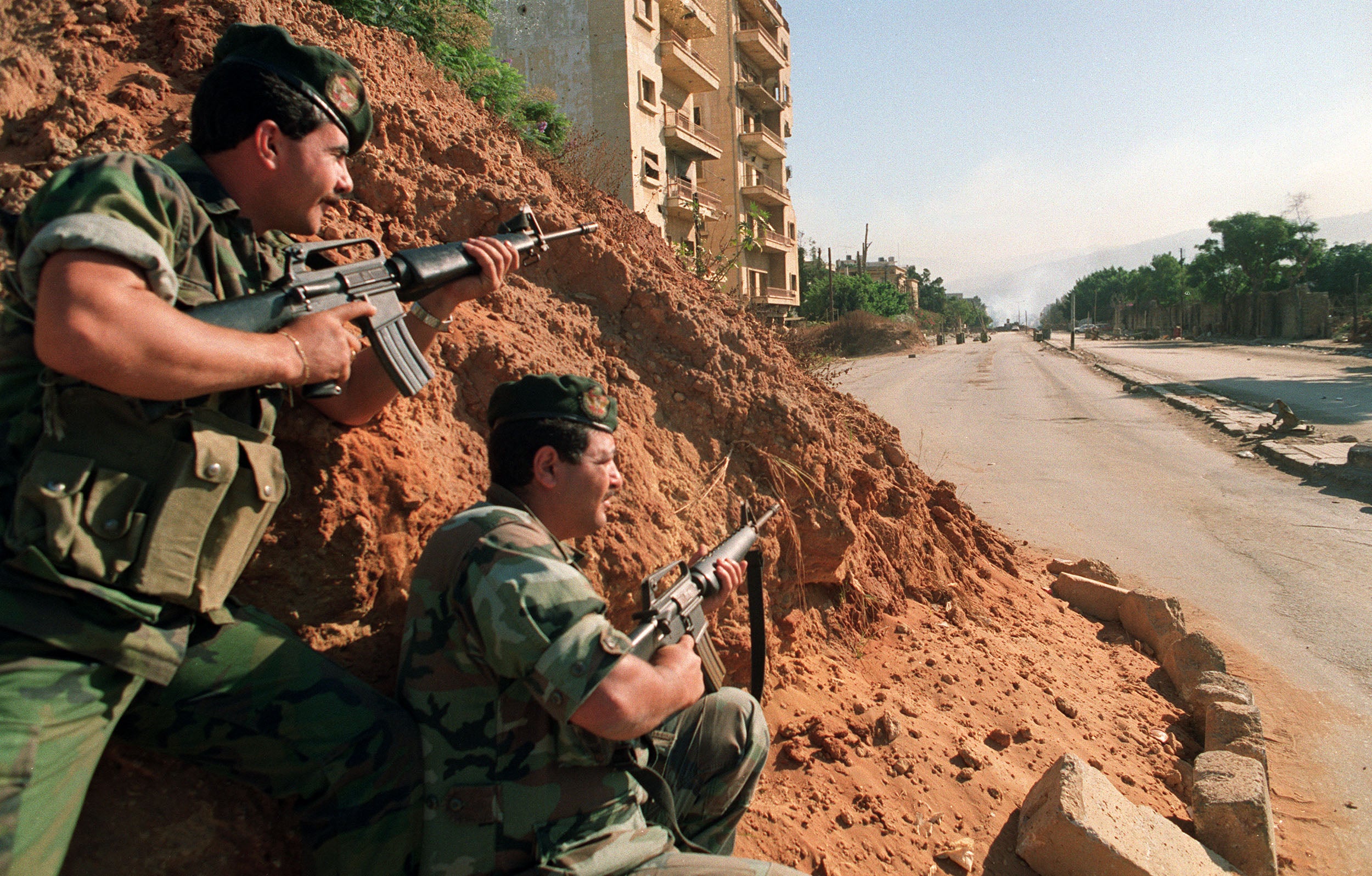 Soldiers loyal to the then Lebanese president, Elias Hrawi, take up a position in Beirut in 1990