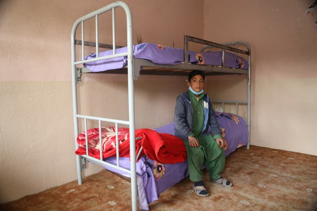 <p>Jawad, 11, with his mother Amina and the PSS worker Amina at War Child UK's GTC in Herat</p>