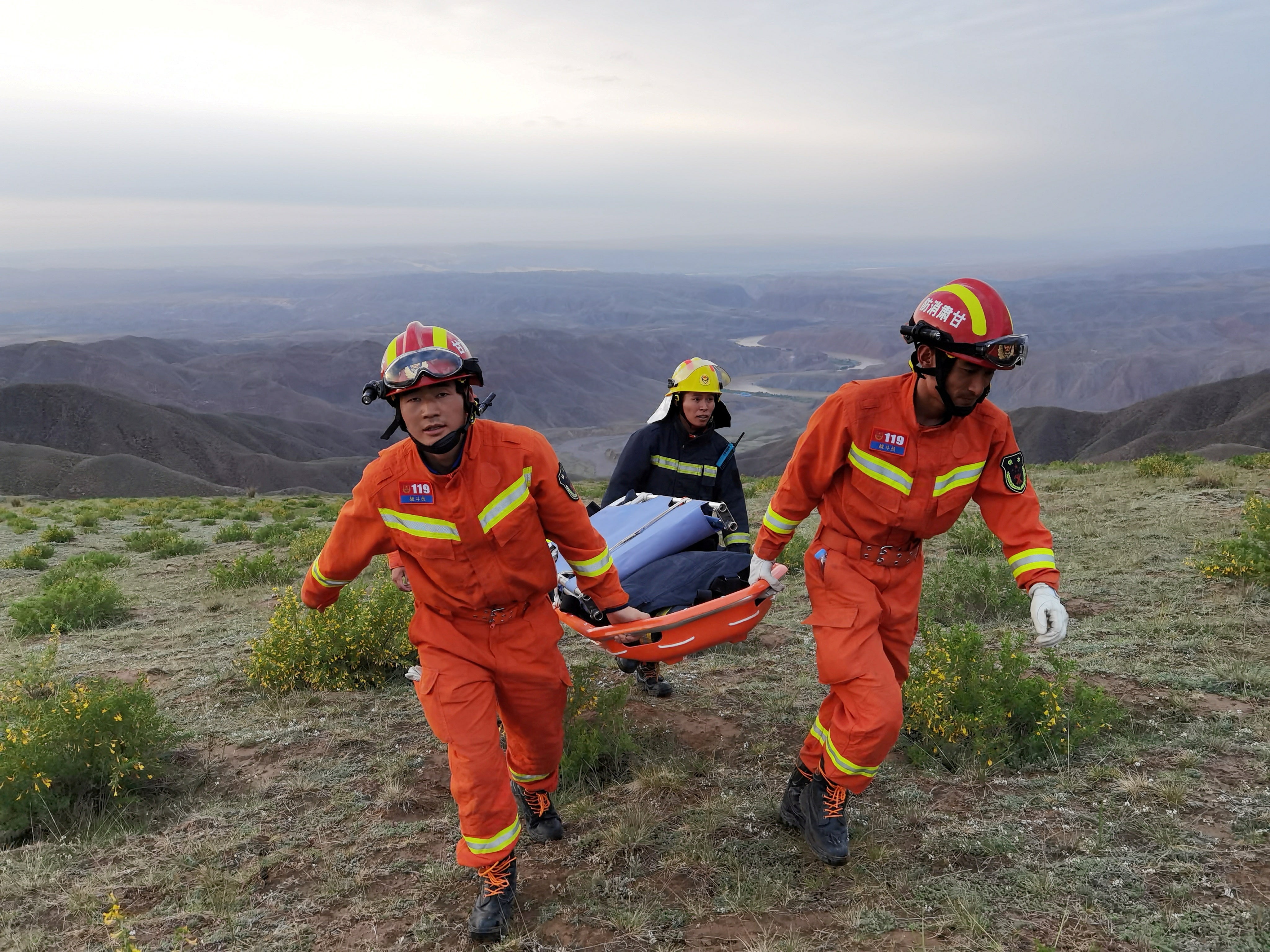 File image: Rescue workers carry a stretcher as they work at the site where extreme cold weather killed participants of an 100-km ultramarathon race in Baiyin, Gansu province, China