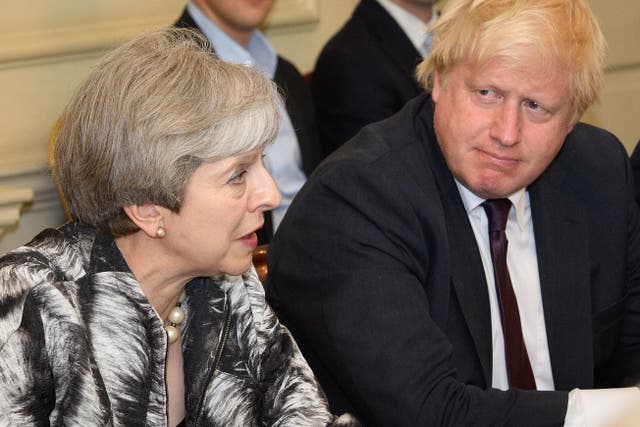 <p>Boris Johnson with former PM Theresa May at the cabinet table in June 2017</p>