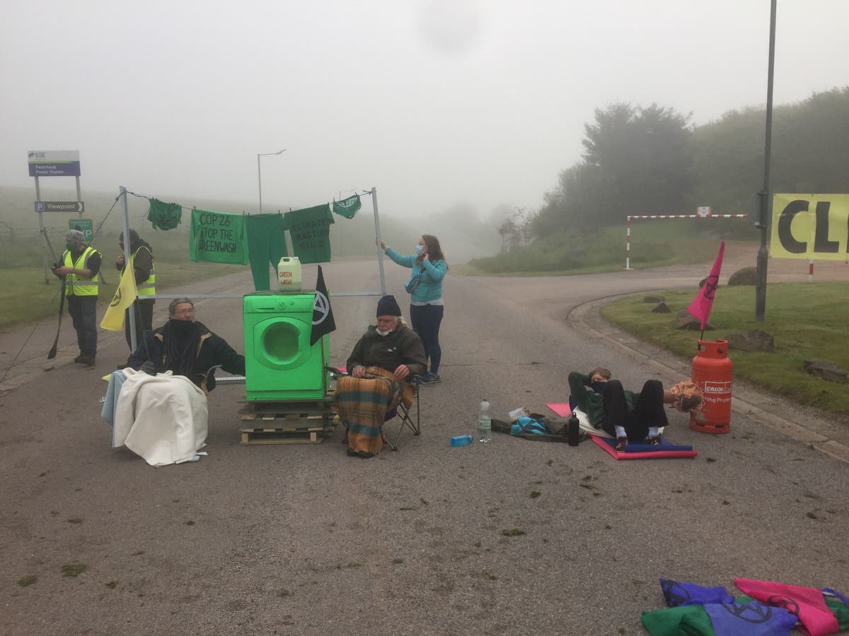 Climate activists block power station with washing machine