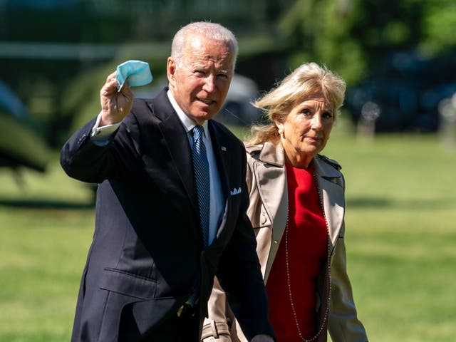 <p>Joe and Jill Biden walk off Marine One at the White House in Washington DC</p>