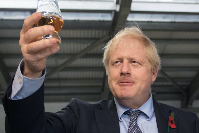 <p>Boris Johnson toasts freedom from Covid restrictions while warning it may have to be postponed</p>