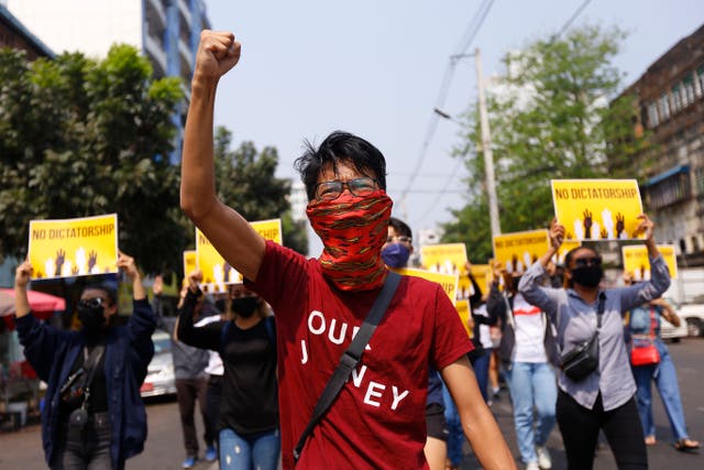 <p> In this 26 March 2021 file photo  anti-coup protesters gesture during a march in Yangon, Myanmar. An American journalist was recently released after spending more than three months inside a notorious Myanmar prison</p>