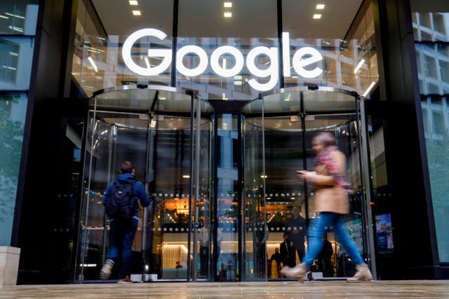 <p>People walk past Google's UK headquarters in London on November 1, 2018. </p>