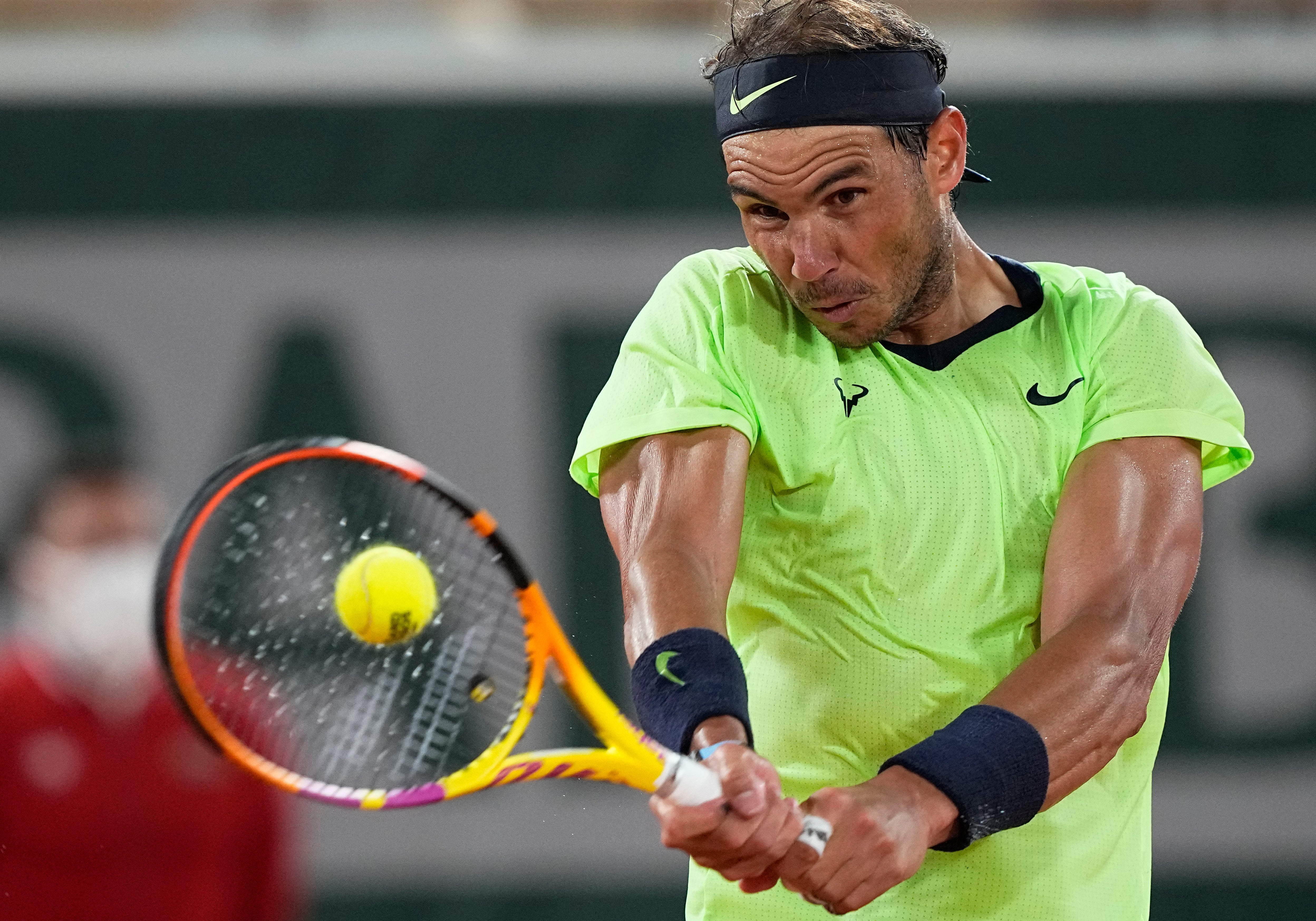 Rafael Nadal drives a backhand during his victory over Richard Gasquet