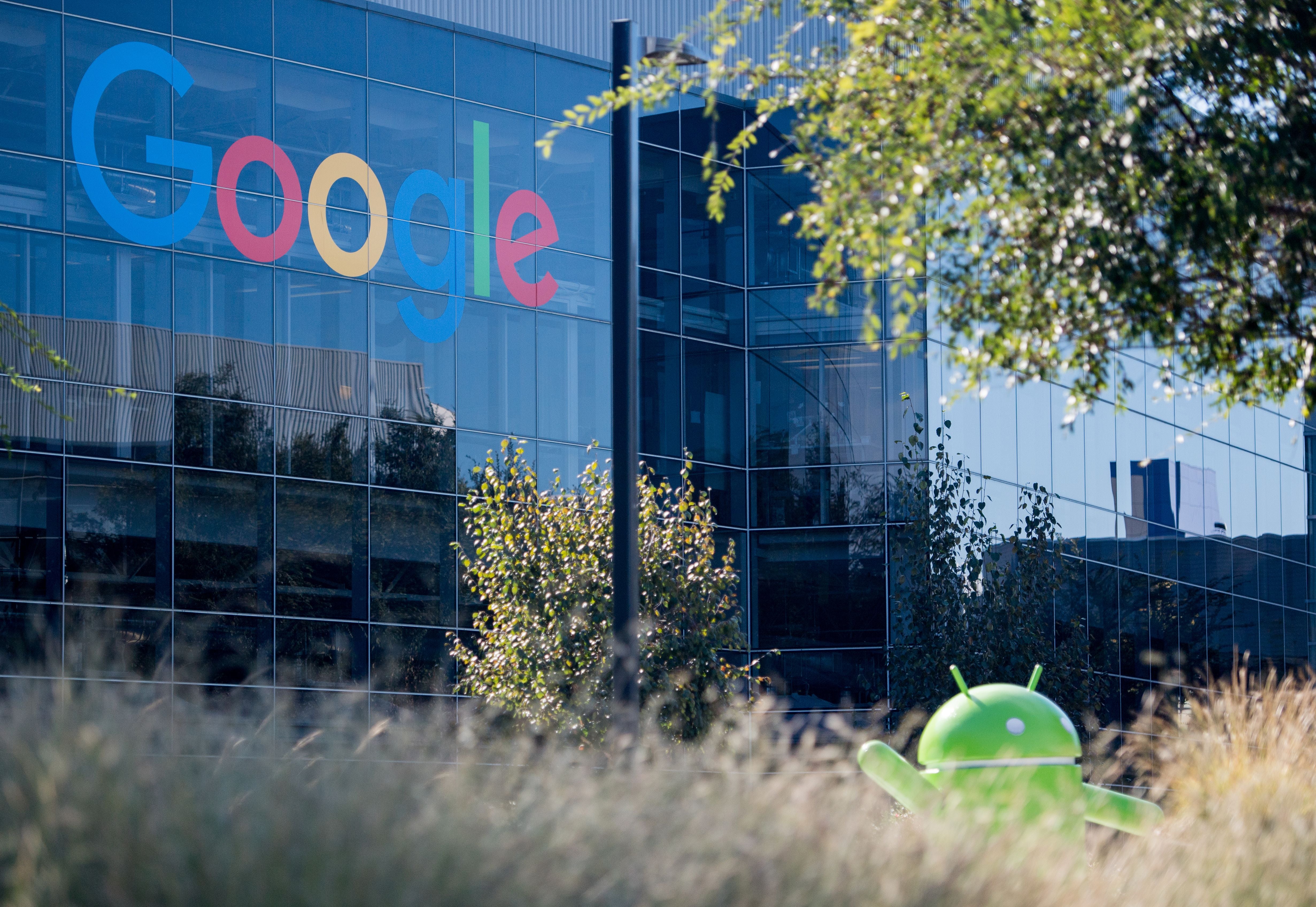 A Google logo and Android statue are seen at the Googleplex in Menlo Park, California