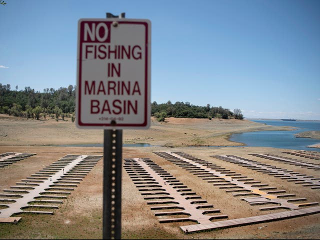 <p>Empty boat docks sit on dry land at the Browns Ravine Cove area of drought-stricken Folsom Lake, currently at 37 per cent of its normal capacity, in Folsom, California, Saturday, 22 May, 2021</p>