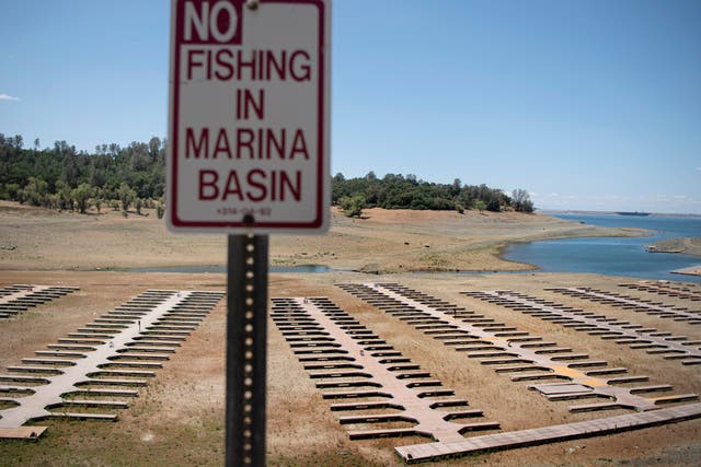 <p>Empty boat docks sit on dry land at the Browns Ravine Cove area of drought-stricken Folsom Lake, currently at 37 per cent of its normal capacity, in Folsom, California, Saturday, 22 May, 2021</p>