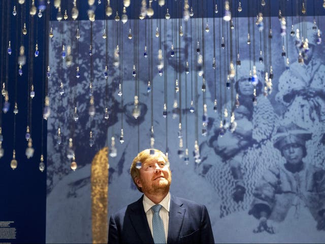 <p>King Willem-Alexander looks on during the opening of the Slavery exhibition at the Rijksmuseum in Amsterdam on 18 May</p>