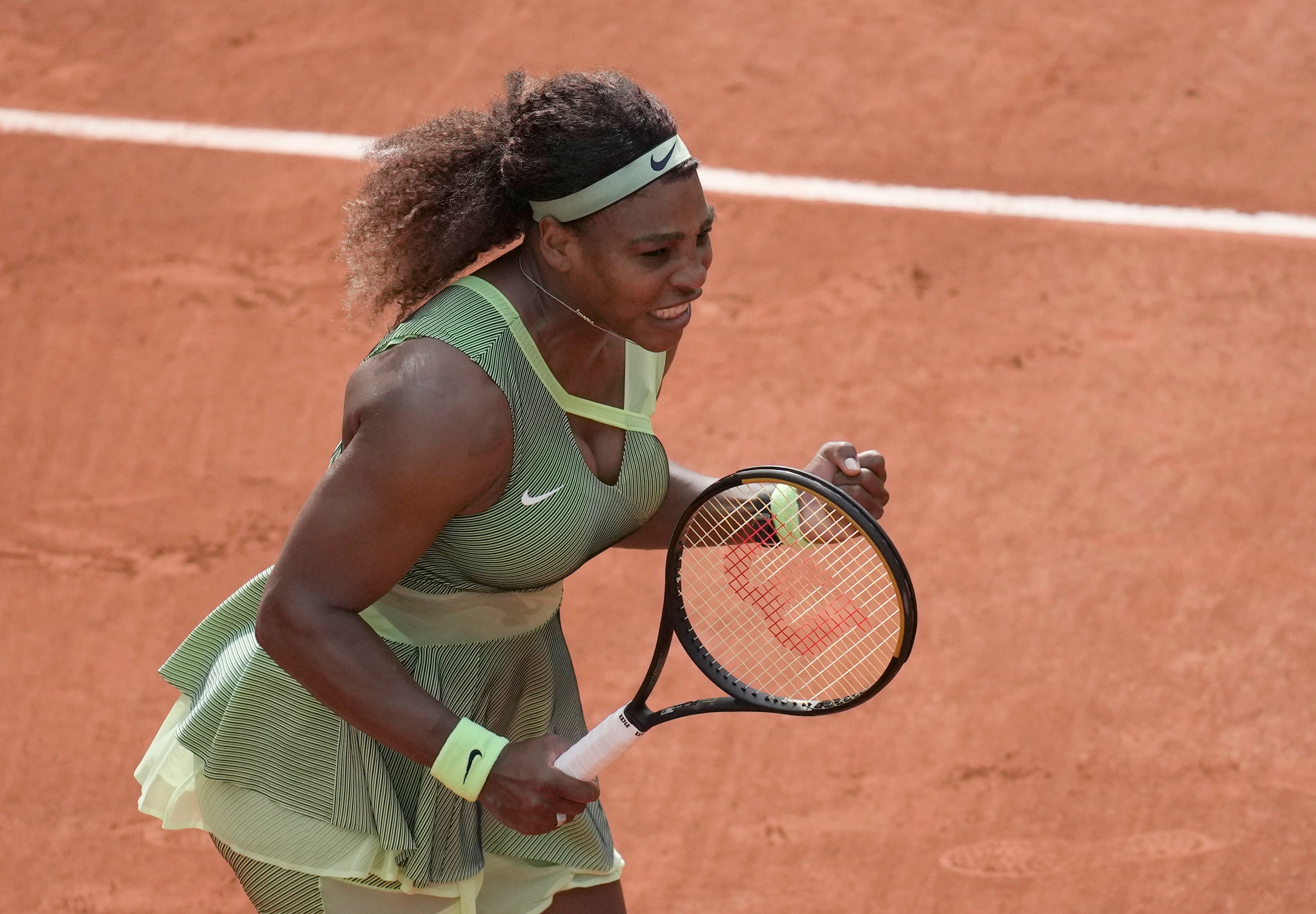 Serena Williams celebrates beating Danielle Collins