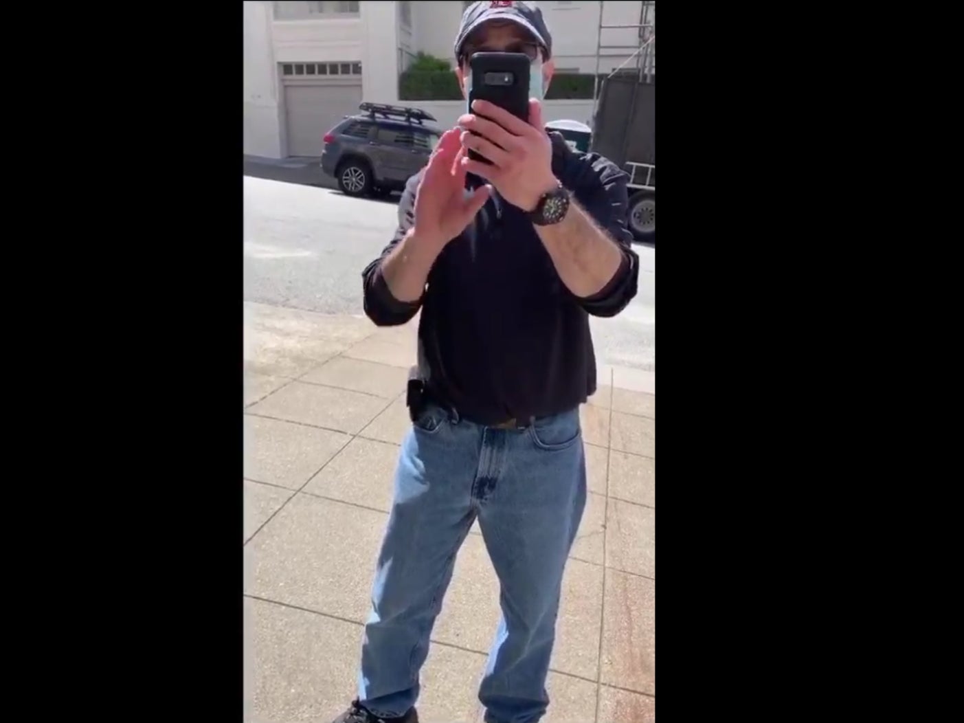 Video showing a delivery driver being quizzed by a white man in San Francisco