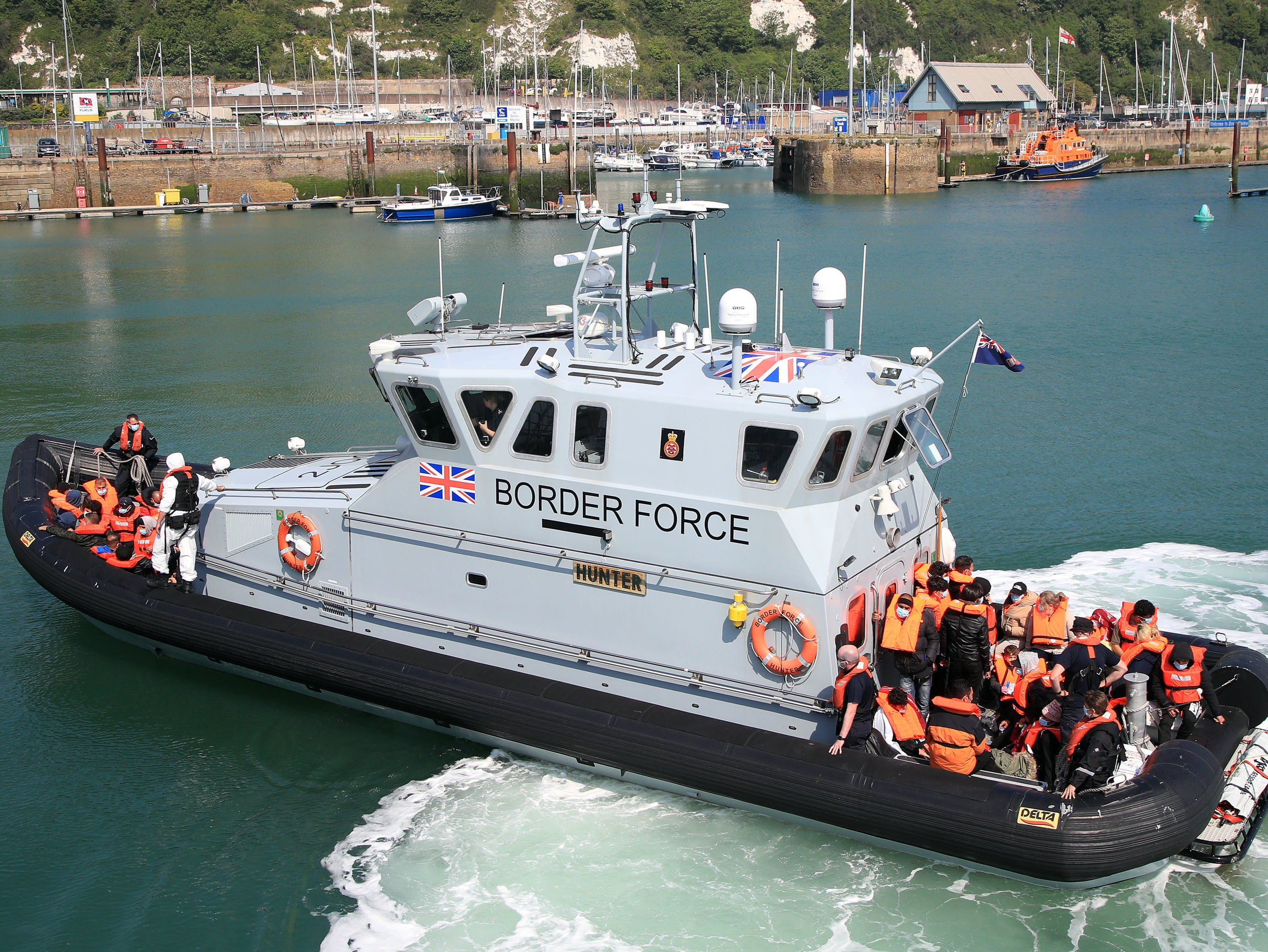A UK Border Force vessel returns to Dover after intercepting a small boat crossing in the Channel on Thursday