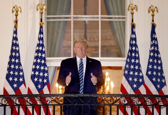 <p>U.S. President Donald Trump gives a thumbs up upon returning to the White House from Walter Reed National Military Medical Center on October 05, 2020 in Washington, DC</p>