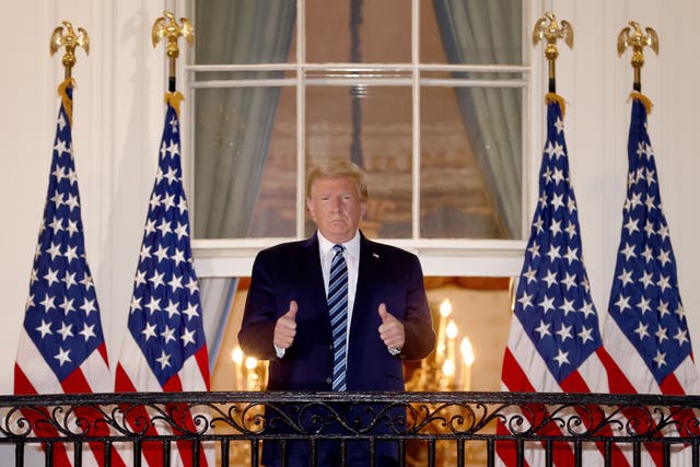 <p>U.S. President Donald Trump gives a thumbs up upon returning to the White House from Walter Reed National Military Medical Center on October 05, 2020 in Washington, DC</p>