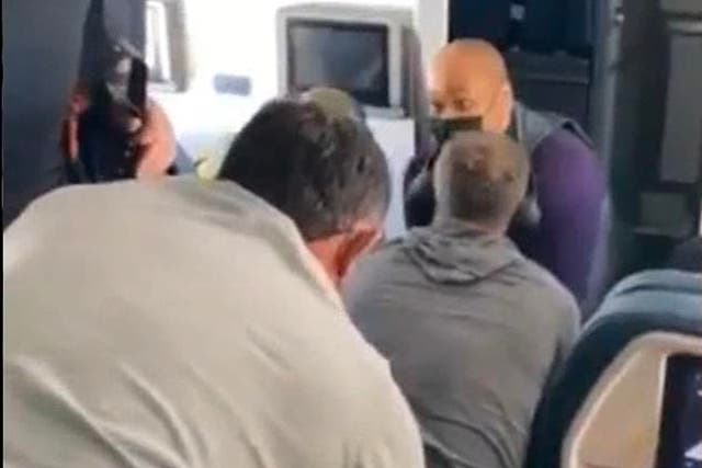 <p>A video posted on Twitter by a passenger on a flight to Nashville shows attendants and passengers holding down a man who reportedly attempted to break into the cockpit</p>