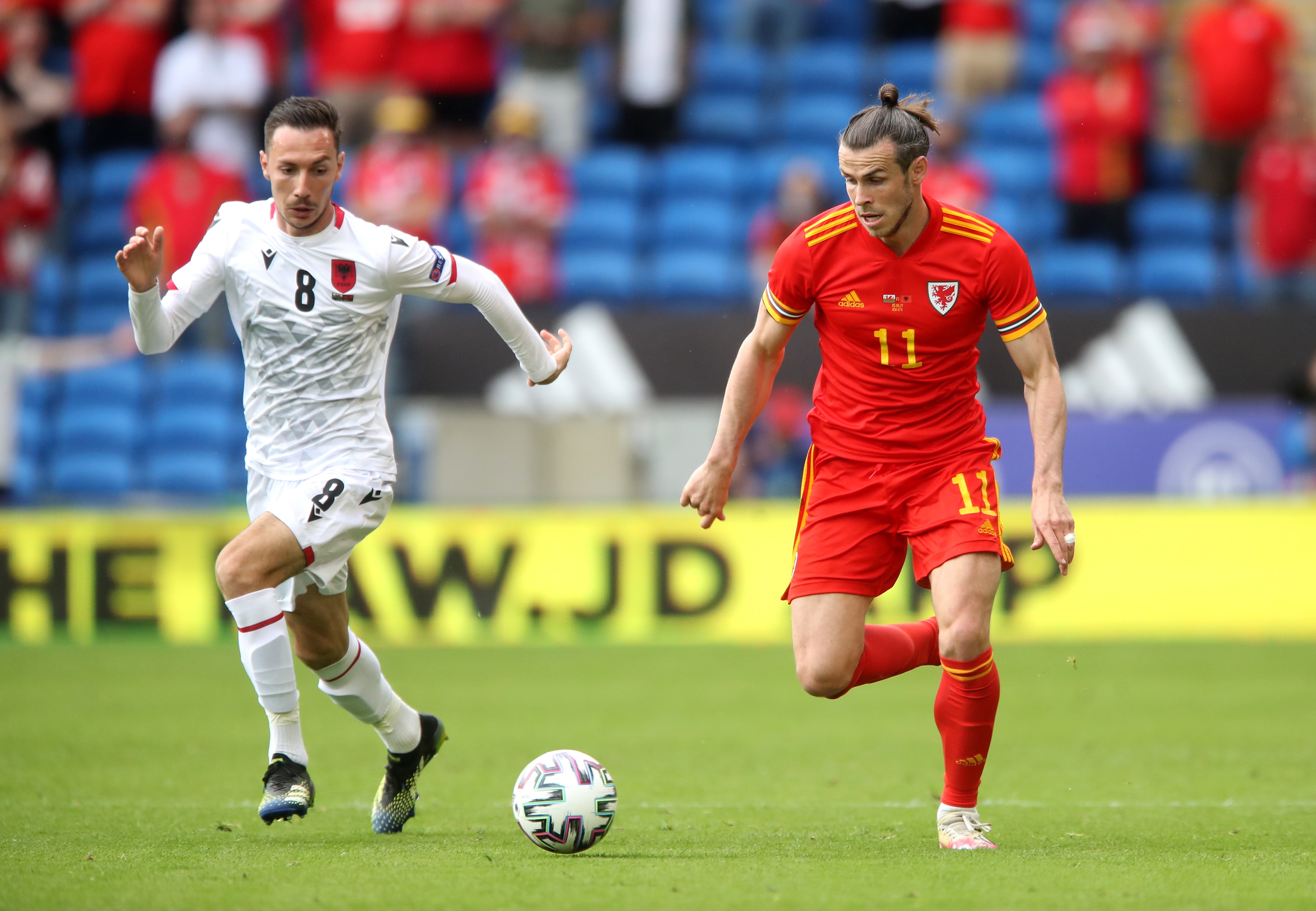 <p>Wales’ Gareth Bale, right, and Albania’s Sherif Kallaku battle for the ball during their goalless draw in Cardiff</p>