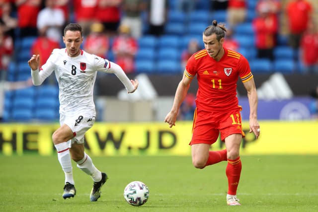 <p>Wales’ Gareth Bale, right, and Albania’s Sherif Kallaku battle for the ball during their goalless draw in Cardiff</p>