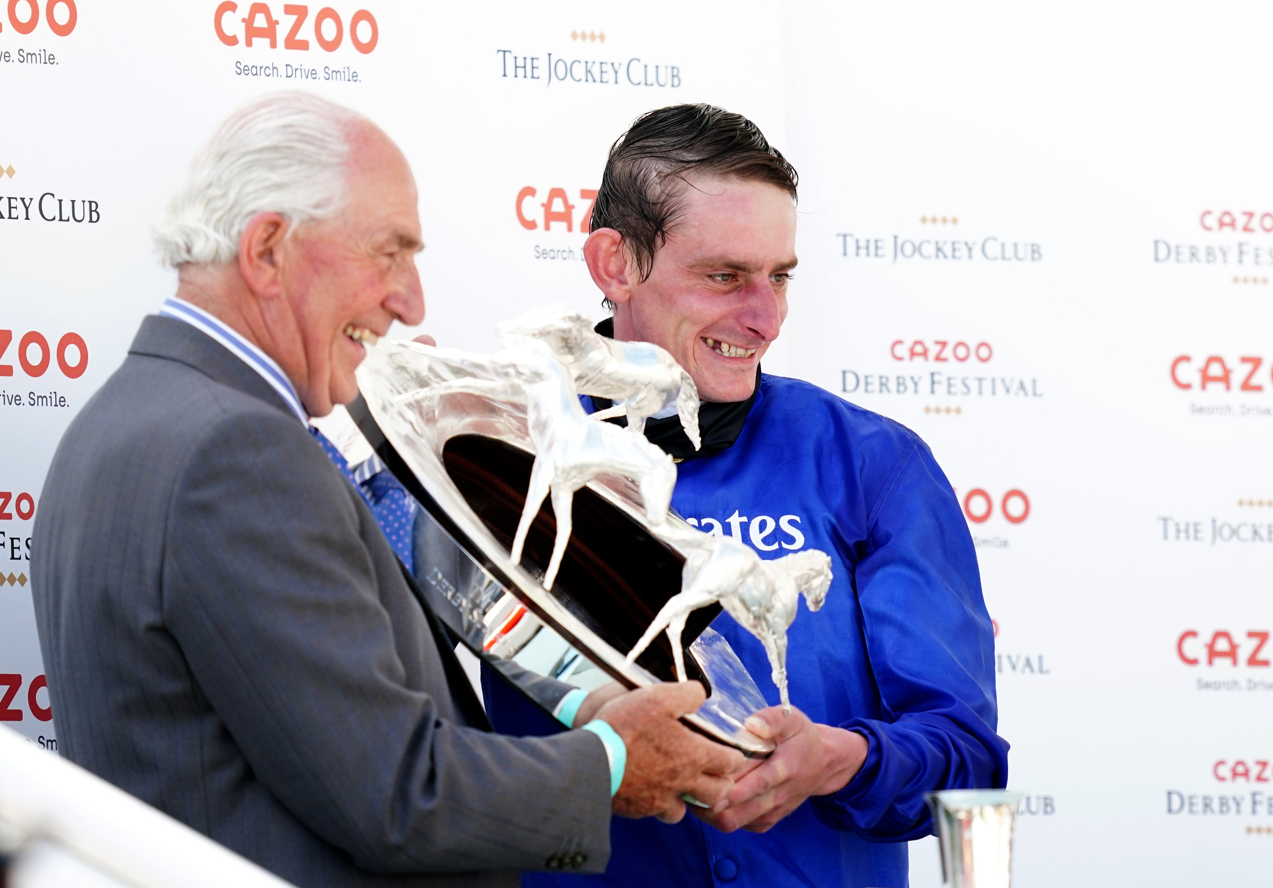 Adam Kirby (right) receiving his trophy after his Derby victory on Adayar