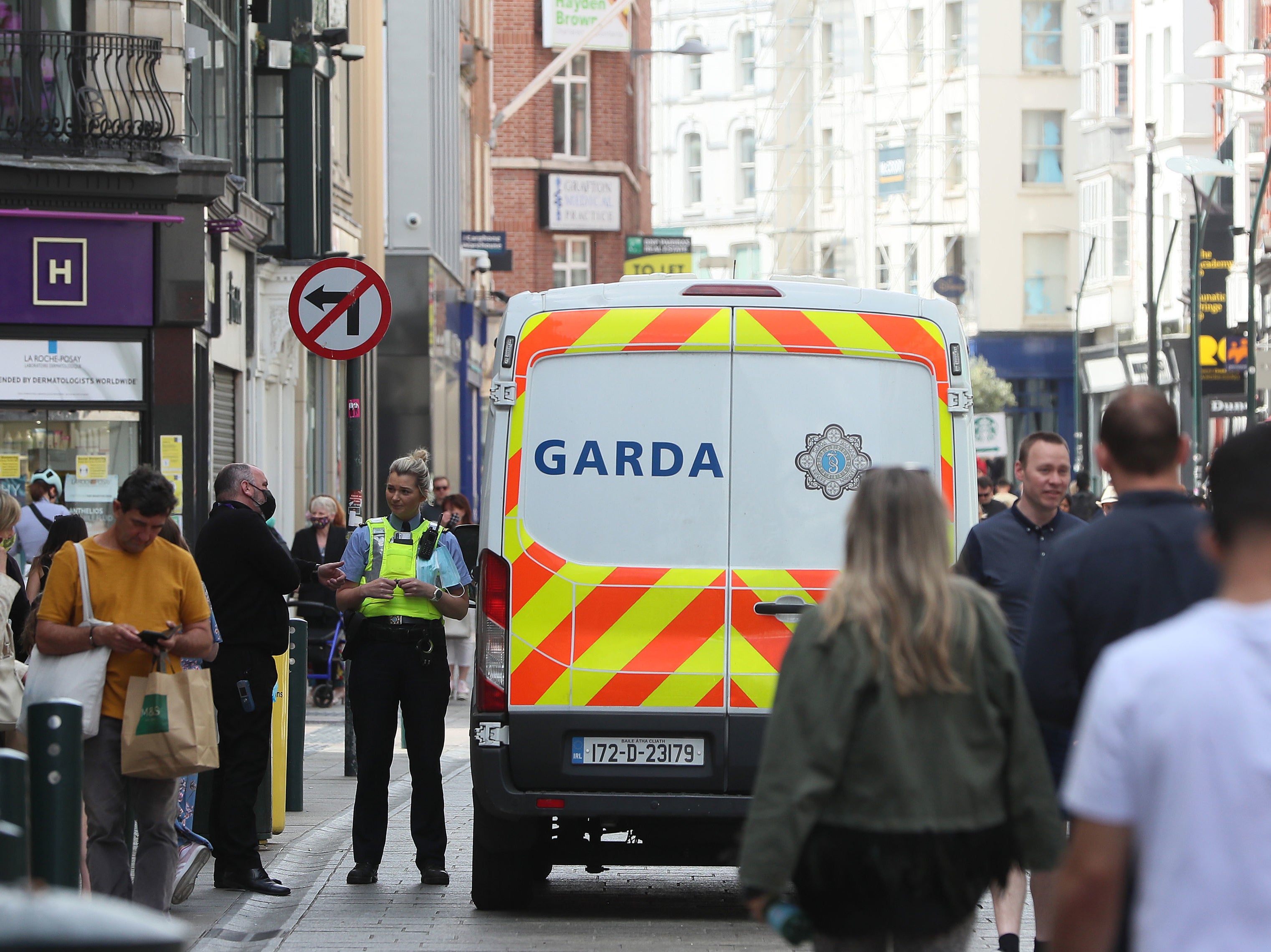 <p>A member of An Garda on Grafton street in Dublin's city centre</p>