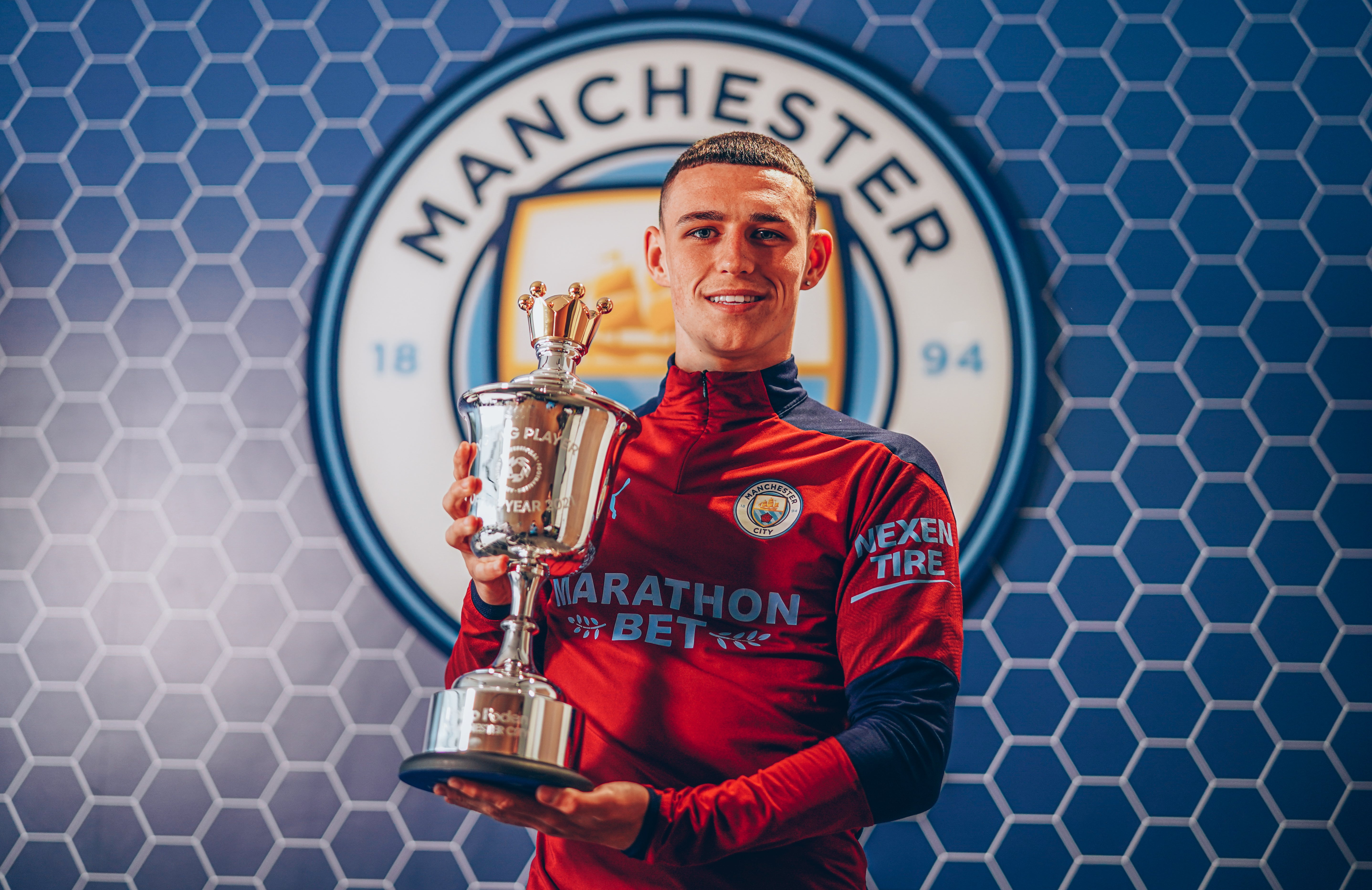 Phil Foden with his award