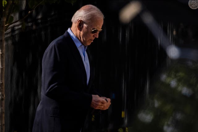 <p>President Joe Biden walks into Holy Trinity Catholic Church to attend Mass on June 5, 2021 in Washington, DC. </p>