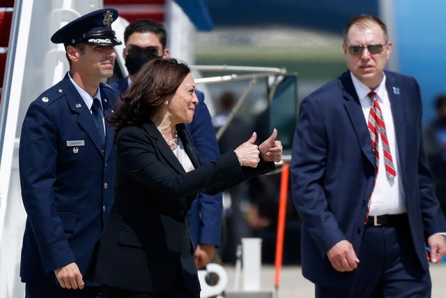 <p>Kamala Harris gives a thumbs-up after her plane was forced to land shortly after take-off</p>