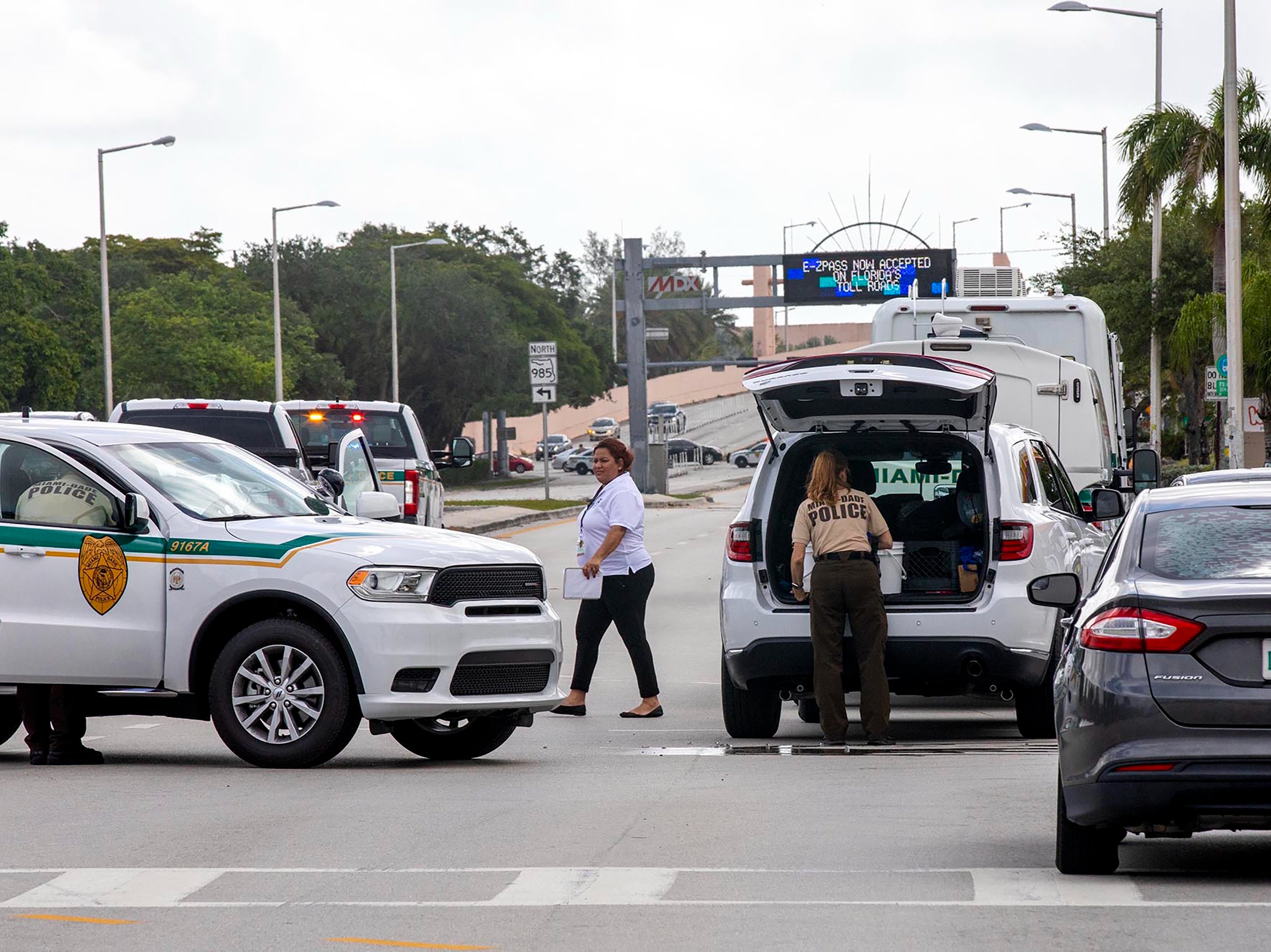 Police block an intersection near the Miami-Dade Kendall Campus in Miami, Fla., on Sunday, June 6, 2021.