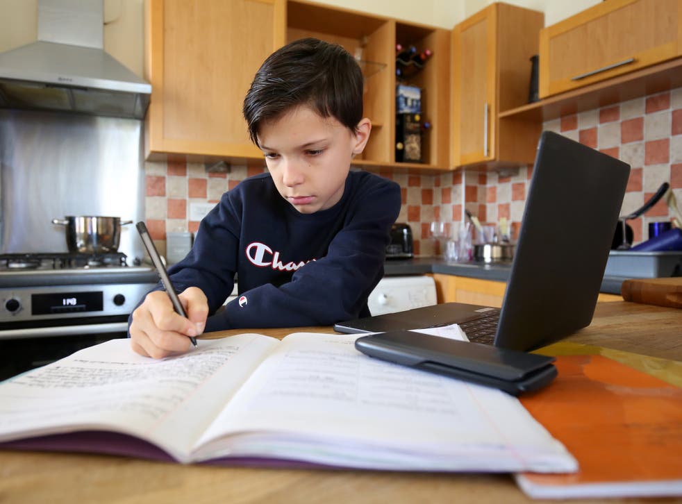 A child does school work at home