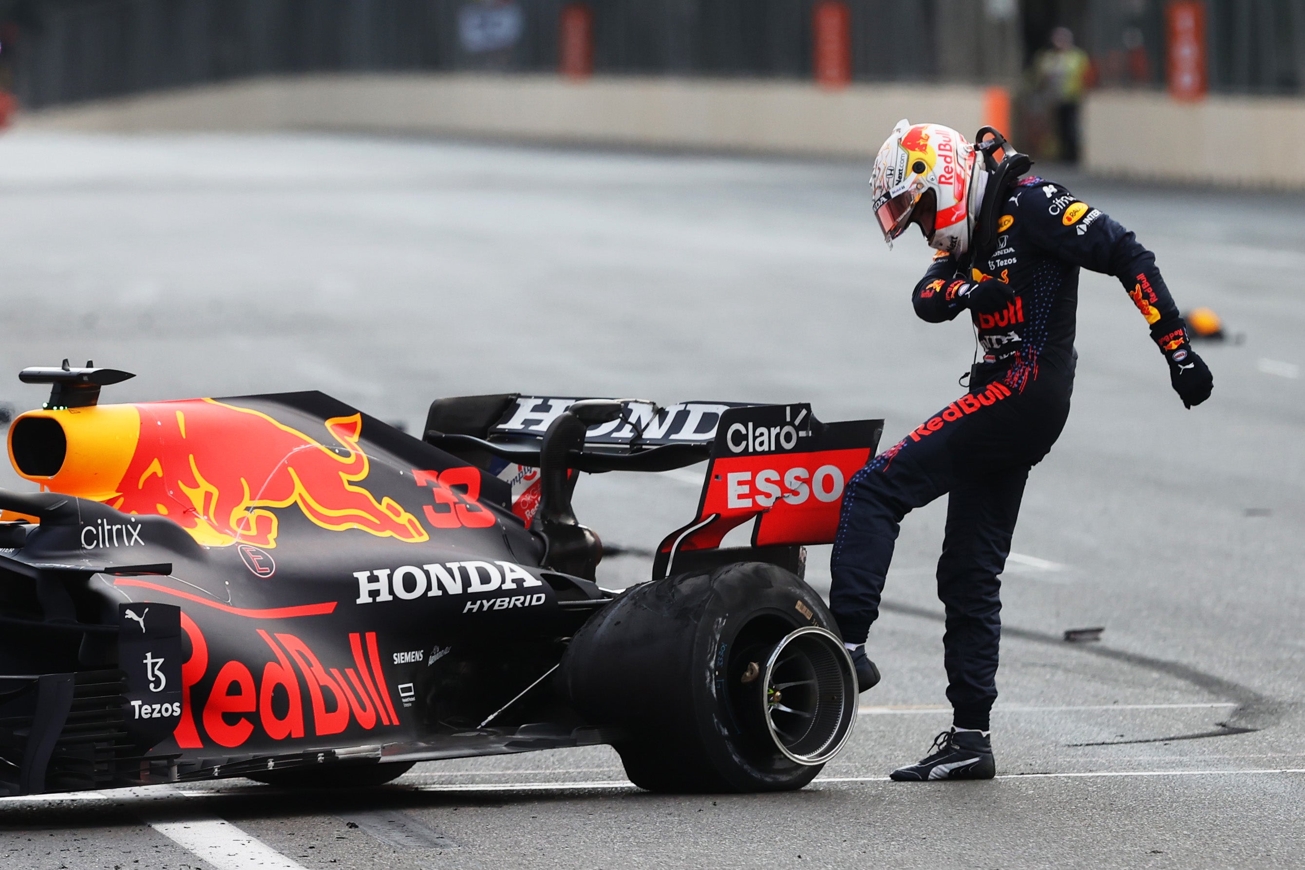 Max Verstappen takes his frustration out on his blown rear-left tyre