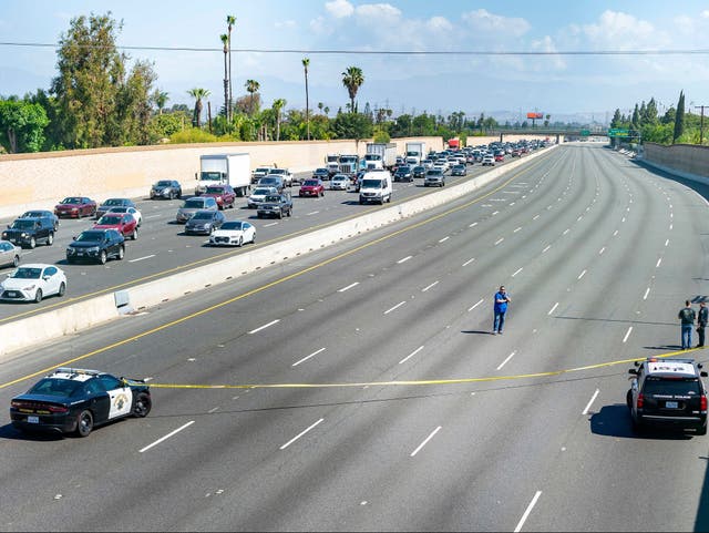 <p>Investigators at the scene of the 21 May road rage shooting in Orange County, California</p>