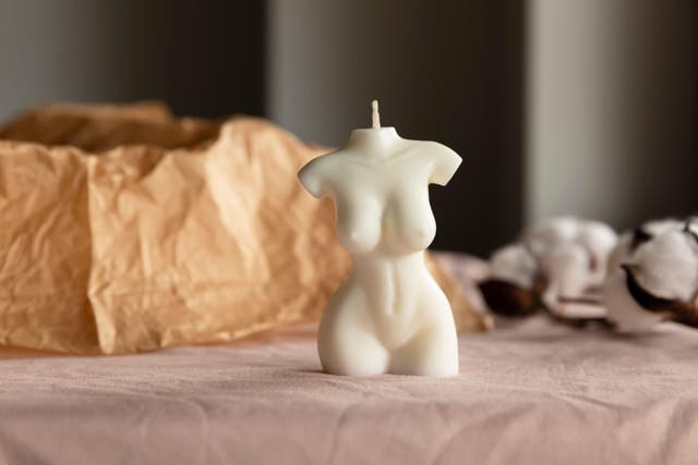 Candle in the form of a naked female body.