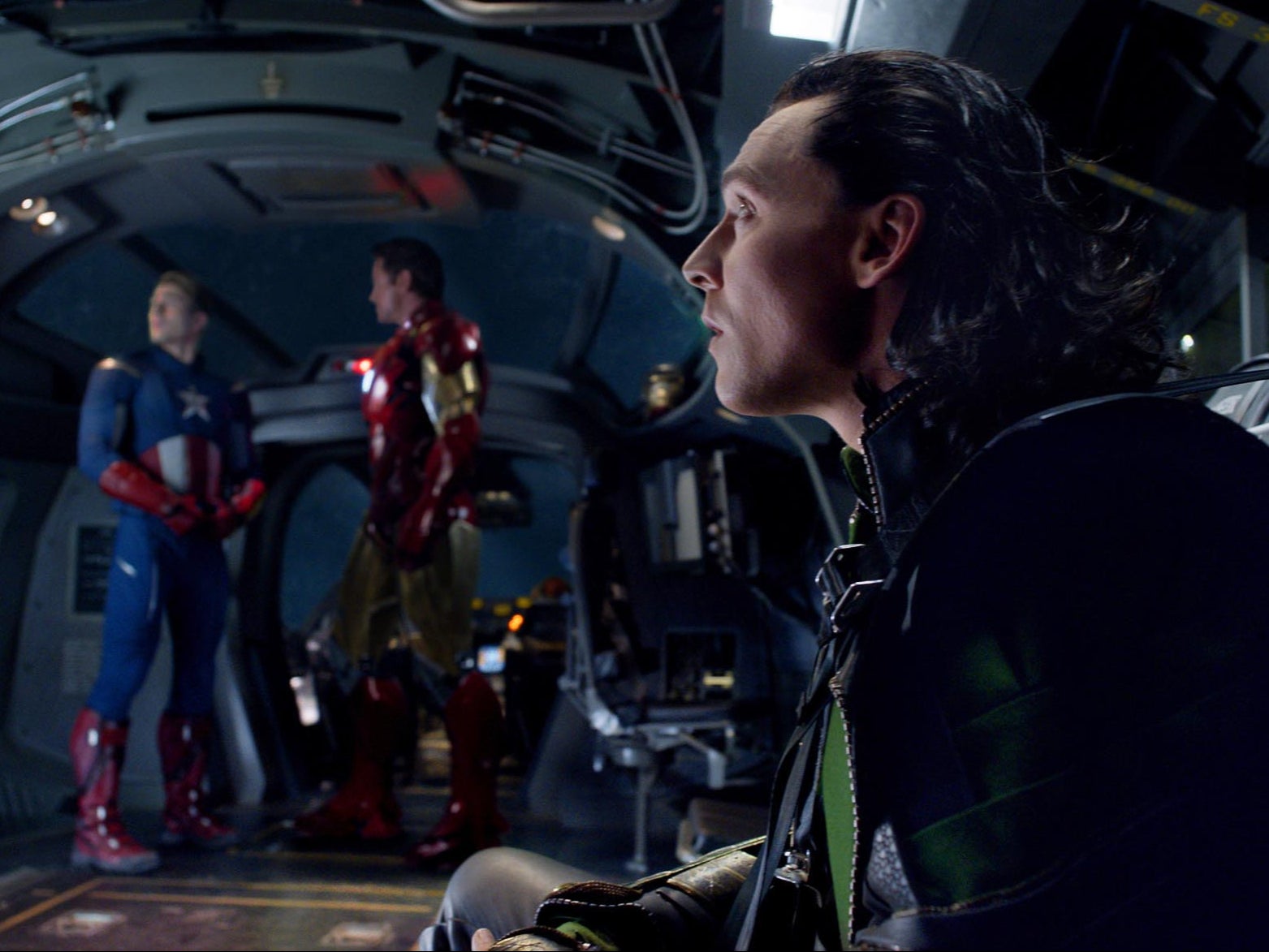 Chris Evans as Captain America, Robert Downey Jr as Iron Man, and Tom Hiddleston as Loki in ‘The Avengers’ (2012)