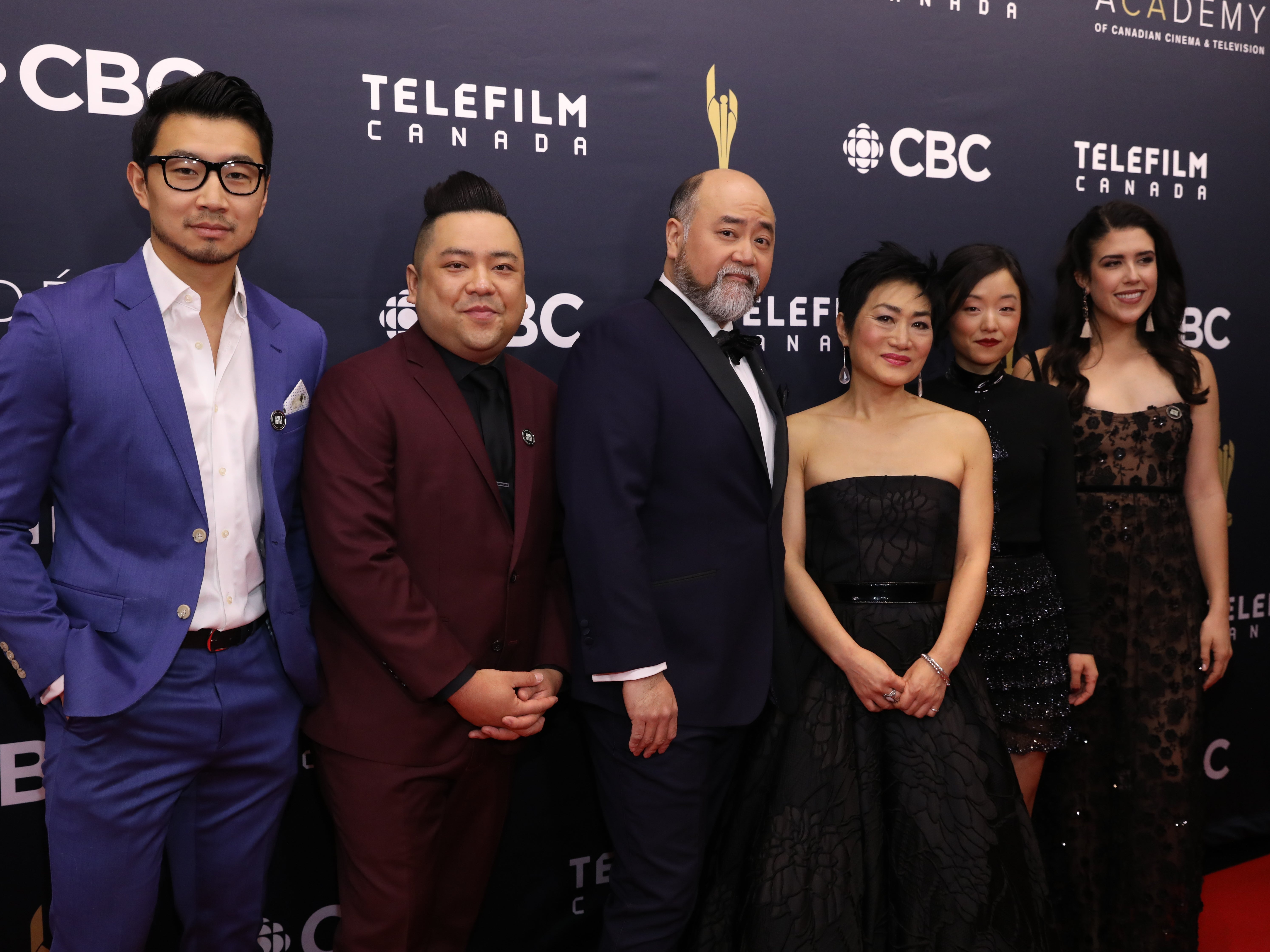 Yoon (third from right) with the cast of Kim’s Convenience