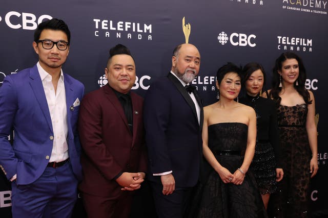 <p>Yoon (third from right) with the cast of Kim’s Convenience</p>