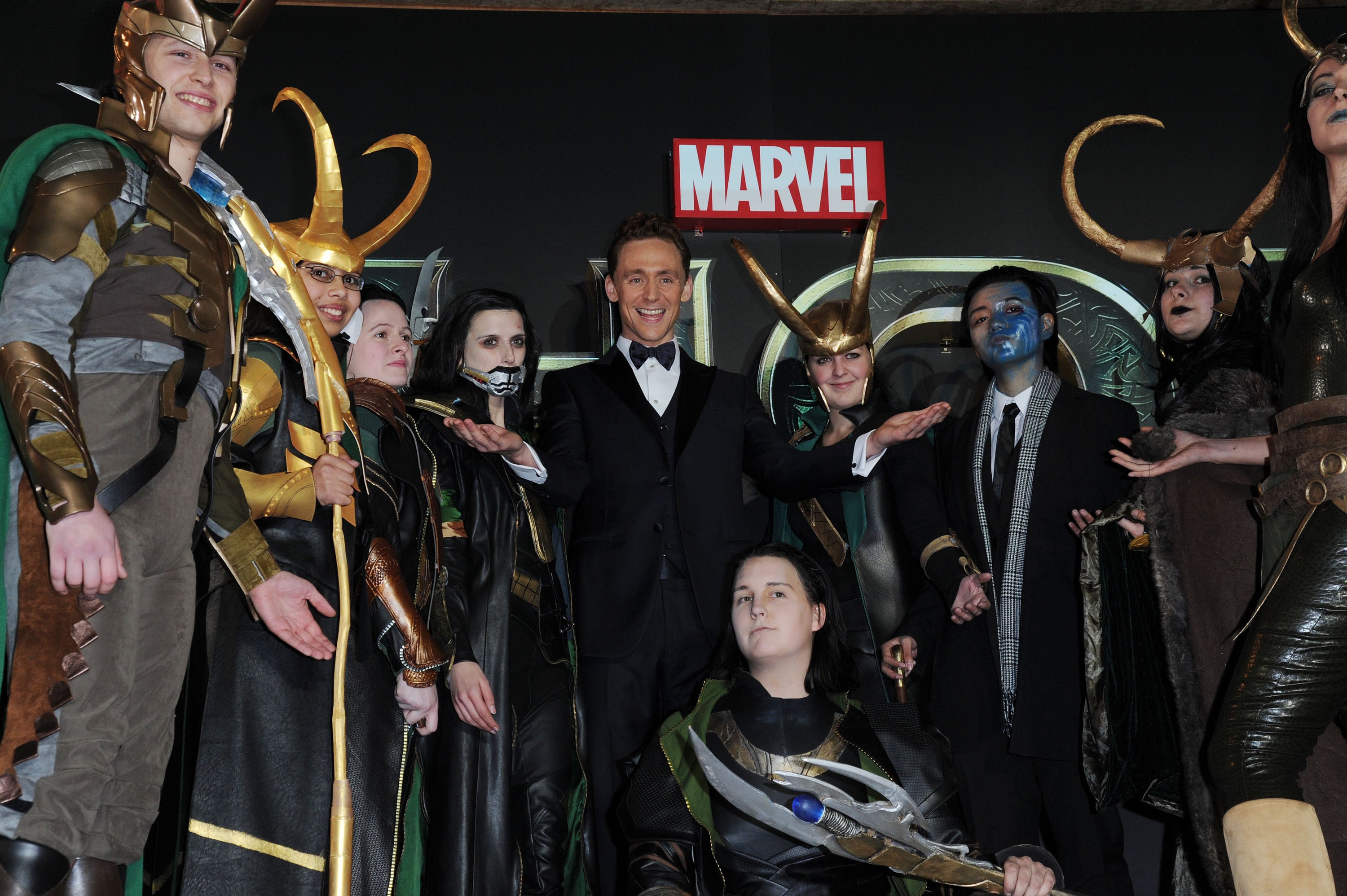 Tom Hiddleston at the premiere of ‘Thor: The Dark World’, surrounded by people dressed as Loki, on 22 October 2013 in London