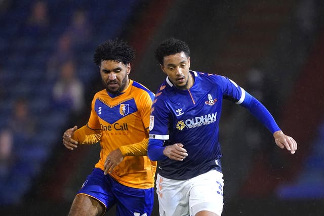 Oldham’s Cameron Borthwick-Jackson (right) will join Burton when his contract expires at the end of the month
