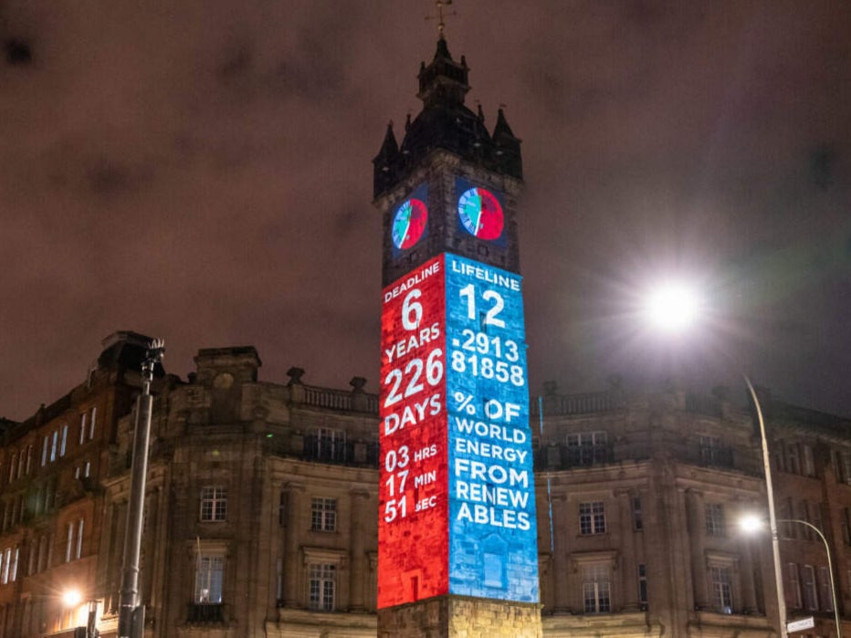 The Climate Clock is projected onto Glasgow’s Tolbooth Steeple
