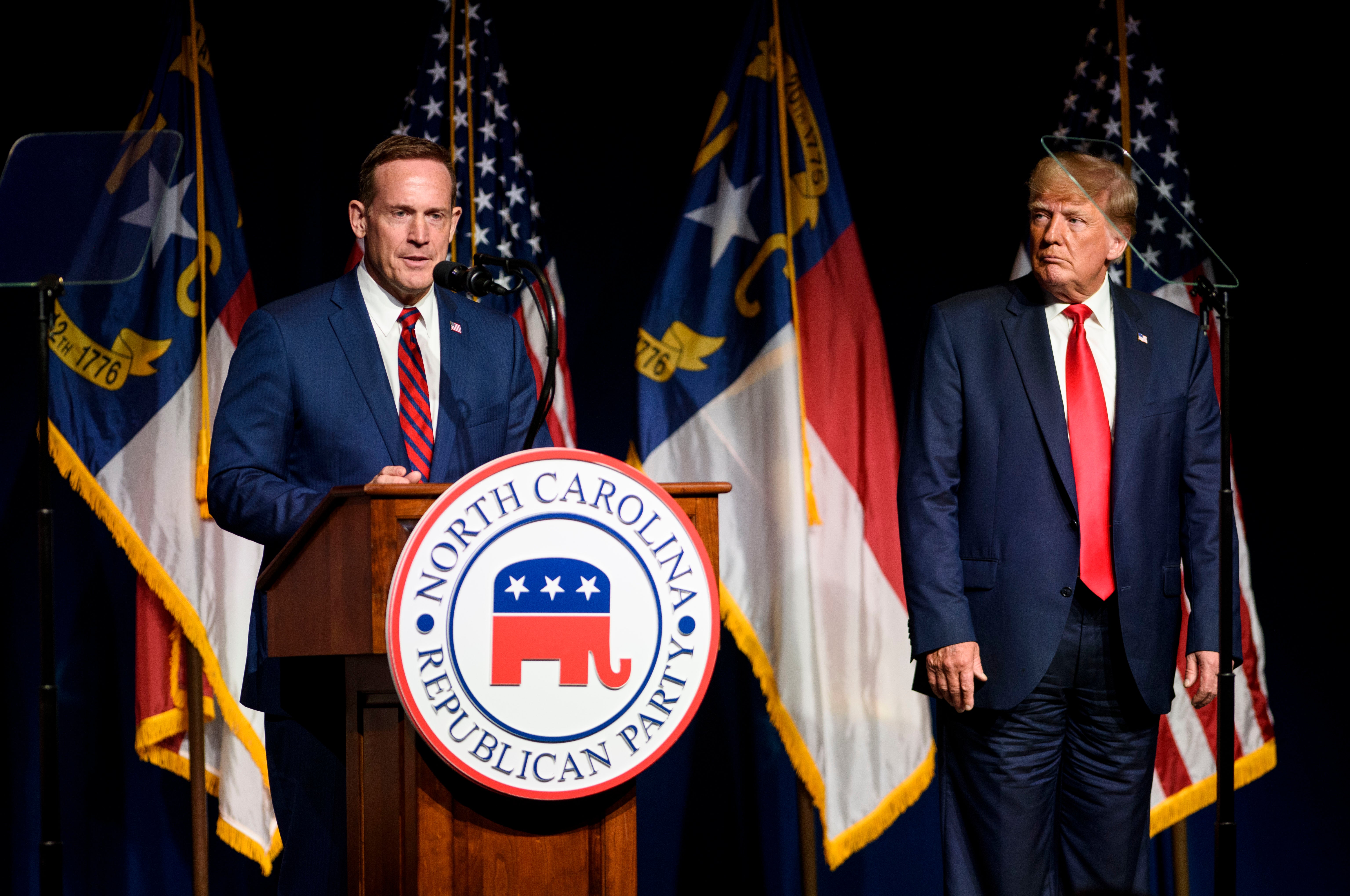 <p>Former U.S. President Donald Trump listens to Ted Budd announce he's running for the NC Senate at the NCGOP state convention on June 5, 2021 in Greenville, North Carolina</p>