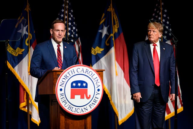 <p>Former U.S. President Donald Trump listens to Ted Budd announce he's running for the NC Senate at the NCGOP state convention on June 5, 2021 in Greenville, North Carolina</p>