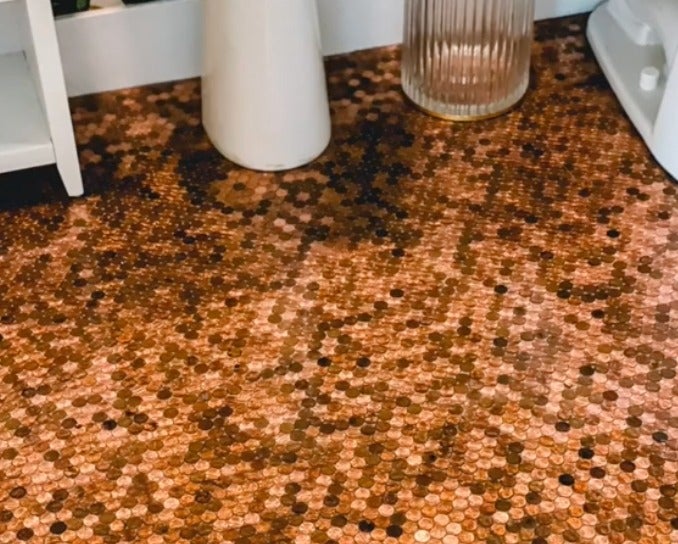 <p>Woman glues 7700 pennies to her bathroom floor and potentially misses out on a fortune </p>