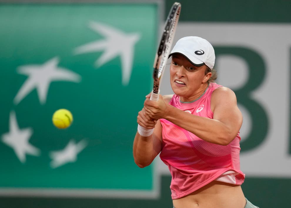 Iga Swiatek on course to defend French Open title after beating Marta ...