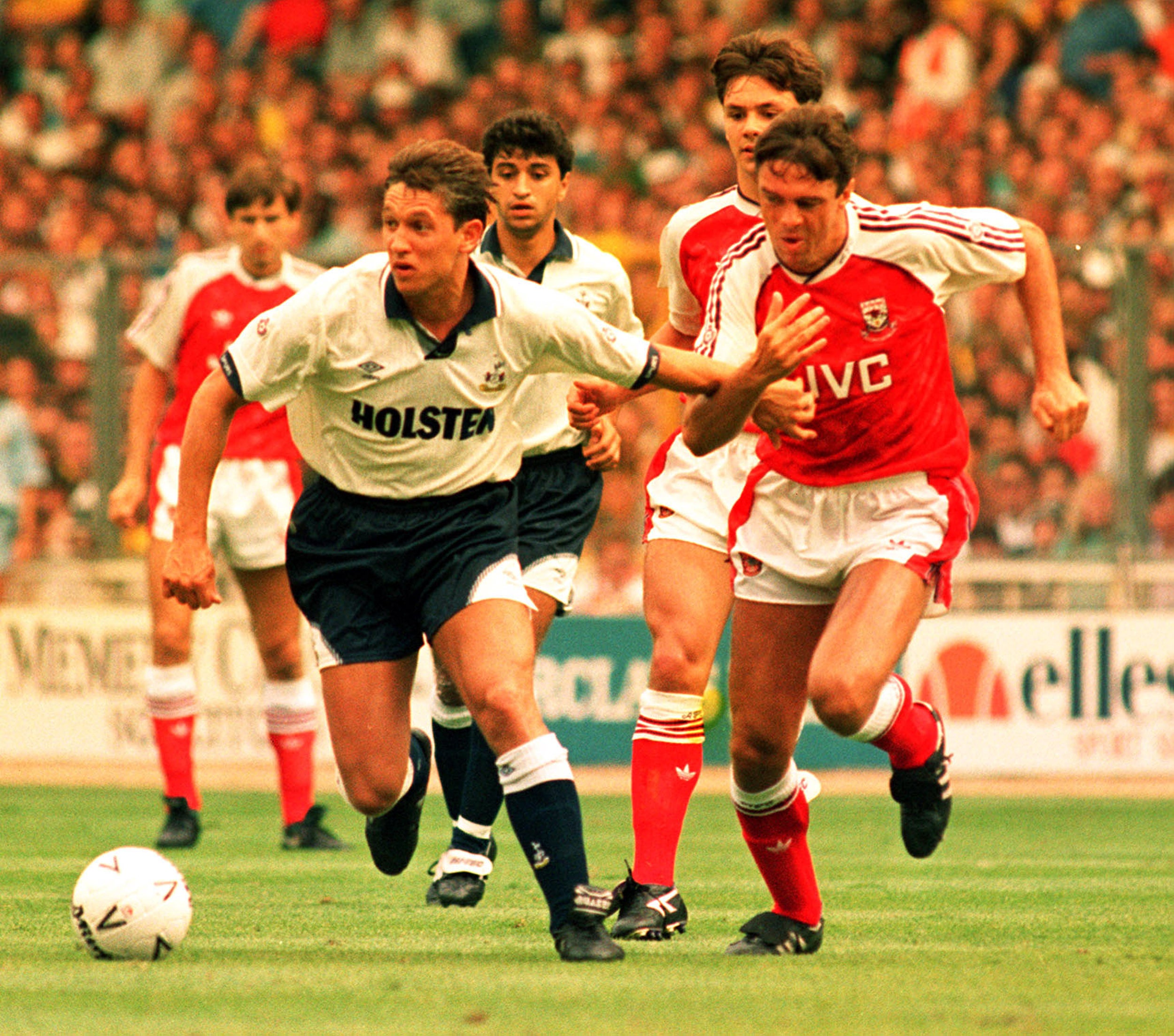 Tottenham's Gary Lineker races away from Arsenal's David O'Leary during the 1991 Charity Shield match