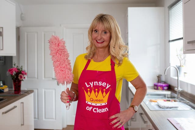 Lynsey Crombie with a feather duster (Lynsey Queen of Clean/PA)
