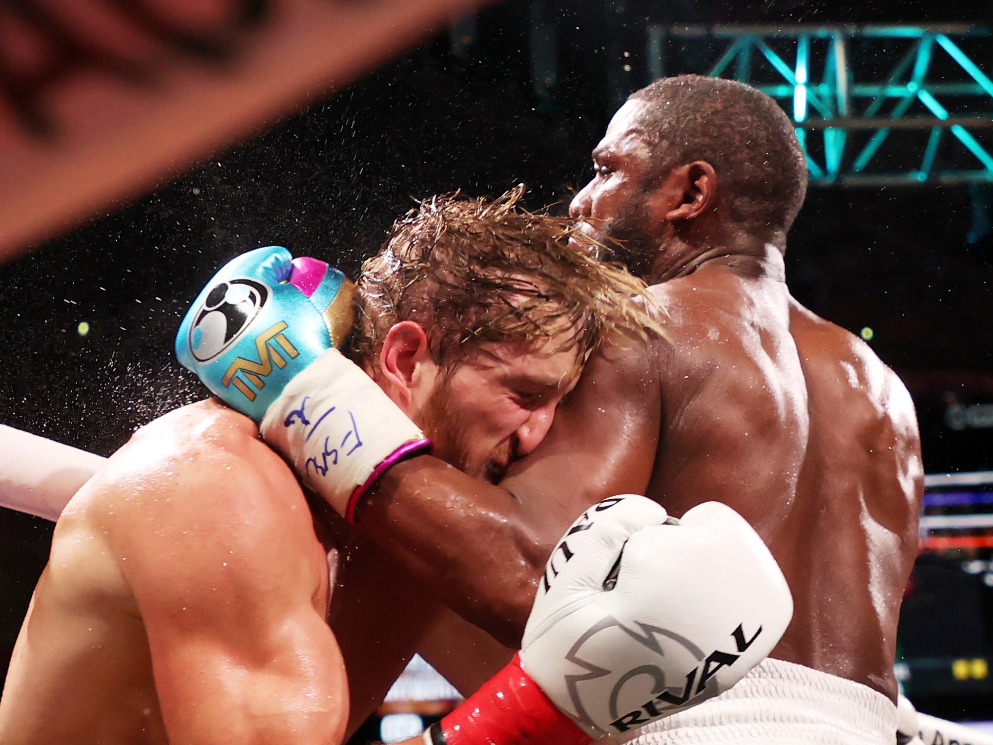 <p>Floyd Mayweather punches Logan Paul during their exhibition in Miami</p>