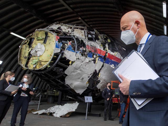 <p>Hendrik Steenhuis views the reconstructed wreckage of Malaysia Airlines Flight MH17 at the Gilze-Rijen military airbase on 26 May 2021</p>