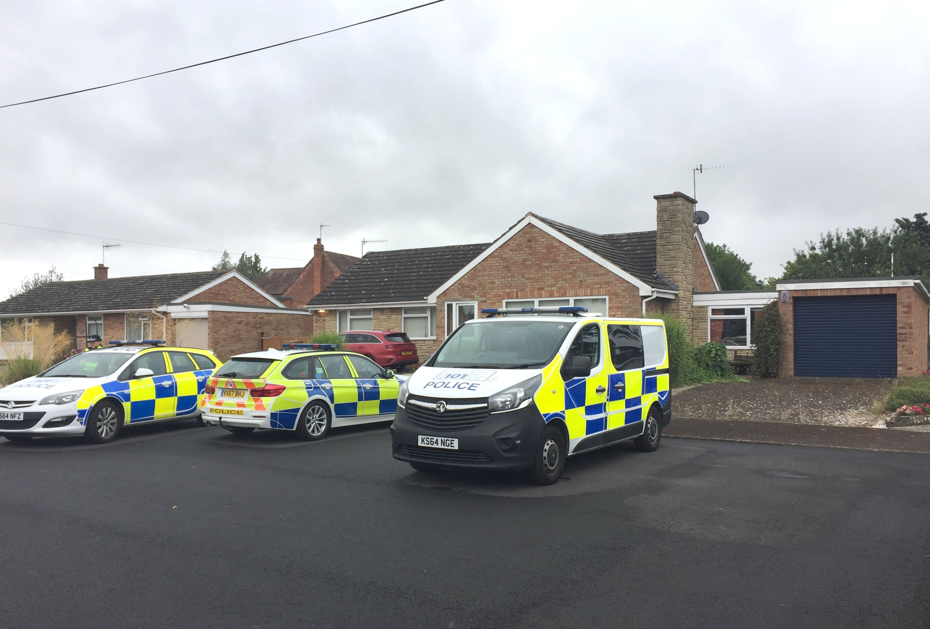 Police officers searching a house in Kempsey, Worcestershire after female human remains were found in a septic tank on July 12