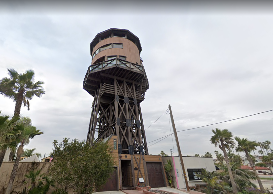 Quirky details inside California’s water tower residence include a secret loft behind a bookcase and a model steam train track hanging from the ceiling